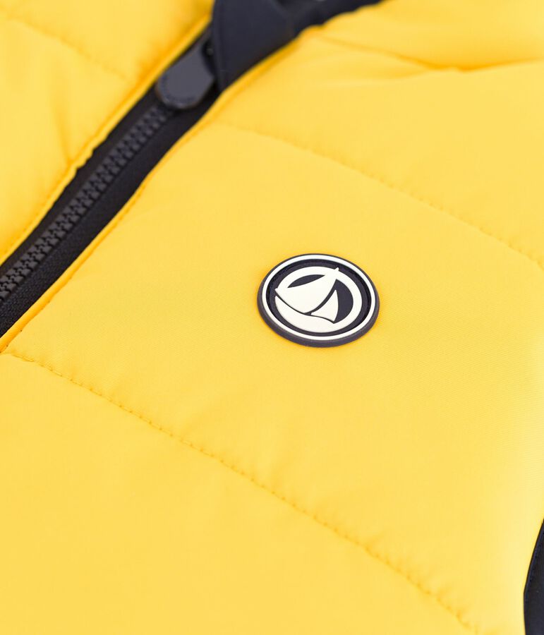 Plum&iacute;fero infantil sin mangas bicolor reversible azul/amarillo