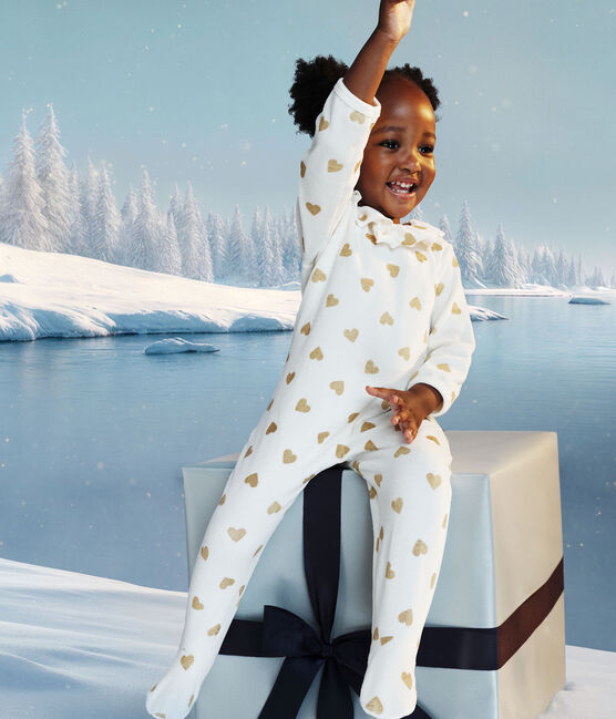 Pijama de bebé en terciopelo con abertura en la espalda y estampado de corazones de lentejuelas. MILK/ DORE