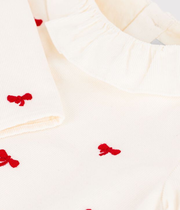 Blusa de terciopelo bordado con estampado de lazos para beb&eacute; crudo/rojo