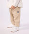 Pantal&oacute;n cargo liso de algod&oacute;n con insignia para beb&eacute; beige