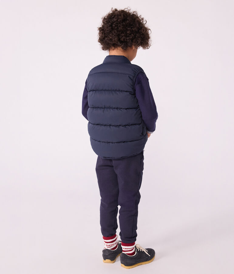 Plum&iacute;fero infantil sin mangas bicolor reversible azul/amarillo